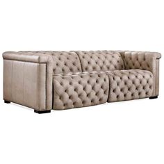 a beige leather couch with buttons on the back