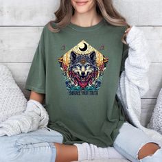 Wiccan Gifts, Wicca Gift, Wolf Tshirt, Witch Gifts, Halloween Gift, Witchy Shirt, Embrace Your Truth, Pagan Shirt, Comfort Colors Tee You'll put a smile on their face when they see this amazing high quality Wolf Tee. The best gifts are both personal and functional, and that's why this unique tee is a fantastic choice DoSayDesigns is the creator and only authorized seller of this tshirt, so you can't find it in retail stores. You'll want the highest quality apparel as a special gift for your friend, work colleague or a family member, and we have them here! SPECIFICATIONS Whether you're out for a morning stroll or just hanging out with friends, you'll love its comfortable, relaxed fit with this Comfort Colors shirt. Made from US ringspun cotton and with a mineral wash feel is super soft and Wolf Design Graphic Tee With Short Sleeves, Graphic Tee With Wolf Design, Short Sleeve, Graphic Tee With Wolf Design Short Sleeve, Pagan Shirt, Wiccan Gifts, Wolf Tshirt, Witch Gifts, Witchy Shirt, Witch Gift