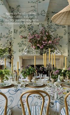 the dining room is decorated with flowers and candles