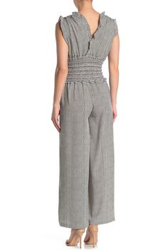 A ruffled V-neck crepe jumpsuit features a fun print for a classy, chic look.Fit: this style fits true to size. . Ruffled V-neck. Cap sleeves. Pull-on style. Side seam pockets. Gathered, smocked waist. Wide leg. Crinkled woven construction. Approx. 54" length, 24" inseam (size S). Imported Machine wash cold 96% polyester, 4% spandex Casual Ruffled Jumpsuits And Rompers For Work, Elegant Ruched Jumpsuits And Rompers For Spring, Sleeveless Jumpsuits And Rompers With Elastic Waistband For Work, Crepe Jumpsuit, Max Studio, Fashion Street, Street Style Women, Cap Sleeves, Smocking