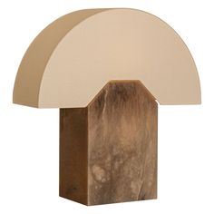 a table lamp with a white shade on it's top and a brown base