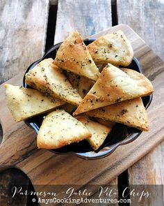 some crackers are in a bowl on a wooden table