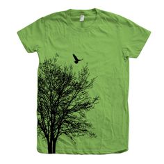 Tree Shirt, Womens Junior Tshirt, Tree Tshirt, Neck, Cotton T-shirt, Bird Shirt, Short Sleeve, Gift for Women, Nature Shirt, Camping Shirt Hand pressed in California by Couth. Printed on Fine Jersey Short Sleeve T Fine Jersey (100% Cotton) construction (Heather Grey contains 10% Polyester). How to order: Sizing: Before ordering PLEASE CHECK our size/color chart (last picture of the listing) for measurements, they run a little smaller than other brands so we recommend to size up if you are in between sizes. THEY HAVE A JUNIOR FIT. A WOMEN'S XL IS ABOUT AN UNISEX SMALL. Please Select your T-shirt's size and color at checkout from the drop down menu on the right and please check the measurements from our size chart (last picture of the listing) Available sizes: S, M, L, XL, 2XL New to Etsy? o Green Cotton Tops With Graphic Design, Green Short Sleeve Shirt With Graphic Design, Green Graphic Design Crew Neck Shirt, Green Crew Neck Shirt With Graphic Design, Tree Costume, Tree Tshirt, Women Nature, Bird Shirt, Nature Shirts