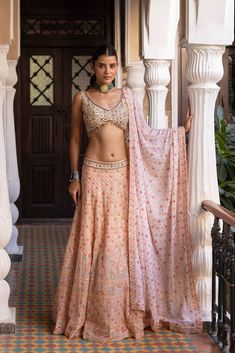 Look your best on wedding occasions in this beautiful powder pink mirror and thread work georgette lehenga. The lehenga comes with a matching dupatta. Shop online from Pure Elegance. Disclaimer: The actual product may vary slightly from the image. These are custom orders, hence expect slight variation in color, placement of the motif or buta. ESTIMATED DELIVERYBecause this is a custom order, it would take about 4 weeks from the date of purchase. RETURN POLICYThis product is a custom order and ca Designer Peach Lehenga With Mirror Work, Peach Lehenga With Mirror Work And Traditional Drape, Pink Lehenga With Gota Work In Chinon, Traditional Peach Georgette Lehenga, Peach Georgette Lehenga With Zari Work, Pink Chinon Choli With Mirror Work, Peach Semi-stitched Georgette Lehenga, Wedding Lehenga In Peach Georgette, Bollywood Style Peach Lehenga With Mirror Work