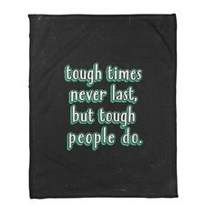 a black blanket with green lettering that says tough times never last, but tough people do