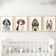 three pictures of dogs hanging on the wall in a baby's room with a crib