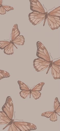 a group of butterflies flying through the air on a light gray background with pink and brown colors