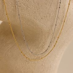 Our Beaded Ball Chain Necklace is a chic and versatile piece that effortlessly elevates any outfit—ideal for everything from casual brunches to evening get-togethers. Wear it anywhere and let its elegant shine make you stand out! SKU: RR-NR220 Product Details Material: High Quality Solid 925 Sterling Silver Finish: 18K Gold ∙ Sterling Silver Featuring a dainty Beaded Ball Necklace with ~1-2mm Beads, adjustable from 16 inches to 18 inches Final Sale Featured Styles Part of our Everyday Essentials 2mm Beads, Beaded Ball, Ball Chain Necklace, Ball Necklace, Station Necklace, Ball Chain, Solid 925 Sterling Silver, Everyday Essentials Products, Chain Necklace