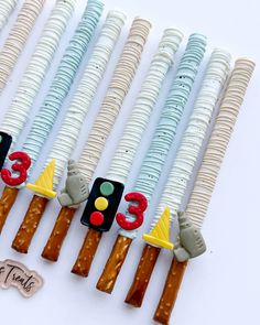 there are some candy sticks that have numbers on them and one has a traffic light