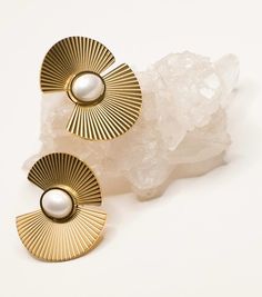 Stand out with the Sophia pearl fan earrings by Musenwolfe, these 18k gold plated stainless steel earrings are party perfect.  These stainless steel beauties are tarnish free and waterproof.  All of our jewelry comes in a beautiful 100% cotton pouch. It makes the perfect gift! Materials: 18k gold plated stainless steel Dimensions: 1.25" x 1.25" Metal Pearl Earrings With Plating For Gifts, Metal Plated Pearl Earrings For Gifts, Gift Pearl Earrings With Metal Plating, Elegant Stainless Steel Earrings For Party, Gold Plated Metal Pearl Earrings, Gold Pearl Earrings Tarnish Resistant, Modern Gold Metal Pearl Earrings, Pearl And Gold Earrings, Statement Pearl Earrings