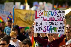 a group of people holding signs in the street