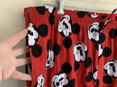 New with tags Mickey Mouse pajama pants. They are red with smiling winking Mickey heads all over. The tag notes they’re from Mickeys 90th anniversary. The waist has elastic and has drawstring. No button on fly. The tag is on the inside. They're cotton. Great to lounge around in! *please compare measurements to a similar item you wear as I do not accept returns. All sales are final* Approx. Measurements (laid flat): Tagged size: XL 18.5in across waist (unstretched) 44.5in length 32in inseam Payme Miki Mouse, Mickey Mouse Pajamas, Mickey Head, Pajama Pants, Lounge, Elastic, Tags, Disney, Pants