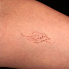 a woman's arm with a tattoo on it that reads i love you in cursive writing