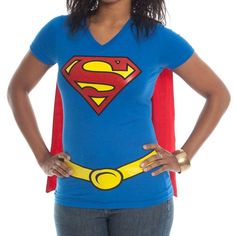 a woman wearing a superman t - shirt with her hands on her hips