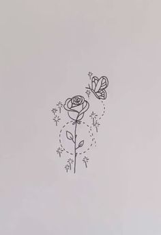 a drawing of two flowers with butterflies flying around them on a white sheet that has been drawn in black ink