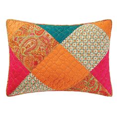 an orange and pink patchwork pillow on a white background