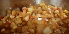 the food is being cooked in the pot on the stove top and ready to be eaten