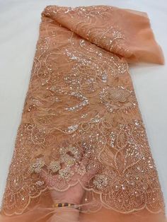 This high quality Fabric is measured in 5 Yards With Embroidered Beading and Sequin. It is soft, very delicate and beautiful. This high Quality Fabric is made with Fashion embroidered rhinestones can be used in making party wedding dresses, skirts, shawls, scarves and other other fashion apparels as you would like. Size : Length : 5 yards (180 inch). Width: 50 inch (Please allow slight deviation for the measurement data ,±1 inch) Material: 100% Polyester, Tulle Lace Fabric, Eco-Friendly embroide Elegant Embroidered Fabric With Rhinestones For Party, Pink Beaded Embroidered Fabric For Party, Elegant Embroidered Fabric With Rhinestones For Wedding, Elegant Rhinestone Embroidered Fabric For Banquet, Elegant Rhinestone Embroidered Fabric For Weddings, Elegant Pink Sequin Fabric For Celebration, Orange Embroidered Wedding Fabric, Pink Beaded Lace Embroidered Fabric, Pink Lace Fabric With Rhinestones Embroidery