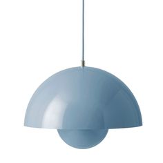 a light blue lamp hanging from a ceiling