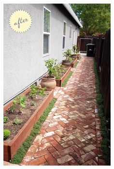 a brick path leading to a house with potted plants on each side and a sign that says after