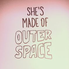 there is a sign that says she's made of outer space on the wall