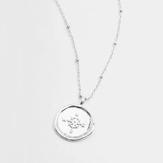 Gorjana's design with the aesthetic of a found object, this unique coin necklace has the feel of a family heirloom. This coin charm centers on an ever-so-dainty ball chain that effortlessly elevates your layered look. Chain extends out to 19" Coin is 3/4" across Spring ring closure Silver plated brass Lifetime manufacturer's warranty Avoid contact with anything containing derivatives of alcohol Coin Necklace Silver, Gorjana Necklace, Gorjana Jewelry, Silver Coin Necklace, Gold Coin Necklace, Coin Necklace, Family Heirloom, Found Object, Brass Material