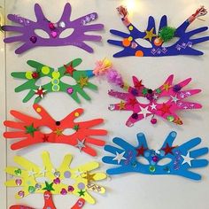 a group of colorful hair clips sitting on top of a white table next to each other