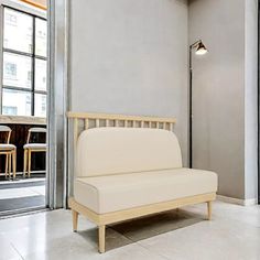 a white couch sitting in the middle of a room