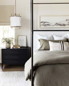 an image of a bedroom setting with white linens and neutral colors on the bed