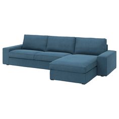 a blue sectional couch sitting on top of a white floor