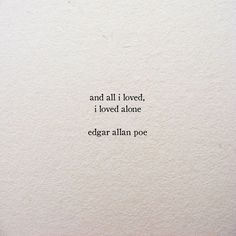 an old typewriter with the words and all i loved, i loved atone edgar allen poe