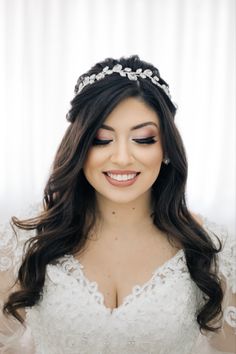 a woman with long hair wearing a tiara