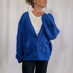 Get ready to cozy up with our Chunky Sweater Cardigan! This royal blue beauty is not only oversized and chunky knit, but it also features a convenient button up design. Perfect for bundling up and adding a pop of color to your outfit. (Go ahead, make a statement!) Also, perfect for gamedays if your team color is blue! Fabric: 100% acrylic I am wearing the size large - This cardigan is fitting oversized. If you are between sizes, you could size down. Stats: height: 5'7 - bust: 37 - waist: 34 - hi Oversized Blue Sweater With Pockets, Oversized Blue Cardigan With Pockets, Trendy Blue Cardigan With Pockets, Trendy Blue Sweater With Pockets, Blue Cable Knit Outerwear For Fall, Trendy Blue Sweater Coat For Fall, Blue Cozy Cardigan For Fall, Cozy Blue Cardigan With Pockets, Cozy Blue Cardigan For Fall