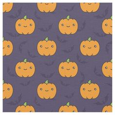 an orange pumpkin pattern on purple fabric