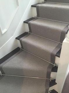 carpeted stairs leading up to a door