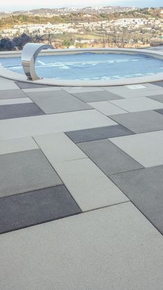 an empty swimming pool surrounded by concrete blocks