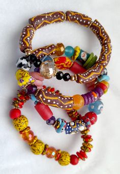 Beautiful Braclets Handmade Glass beads New handmade from recycled glass made by traditional artisans in Africa Different colours  Each bead is approx.9mm wide Made using traditional methods of bead making, each bead is slightly different as they are individually designed environmentally friendly and sustainable way.  Free shipping when you purchase 2 or more  at a time Festival Large Beads Multicolor Beaded Bracelets, Multicolor Large Beads Festival Bracelets, Multicolor Large Beads Bracelet For Festivals, Festival Multicolor Large Beads Bracelet, Traditional Multicolor Stretch Bracelet With Large Beads, Artisan Beaded Bangle Bracelets For Festivals, Traditional Multicolor Stretch Bracelet With Wooden Beads, Festival Beaded Bracelets With Large Beads, Festival Large Beads Beaded Bracelets