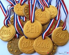 gold and silver medals with red, white, and blue ribbons around them that read ben 2016