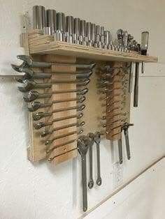 there are many tools hanging on the wall