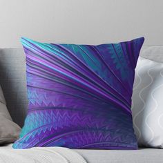 a blue and purple abstract design on a couch