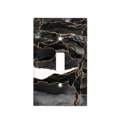 a black and white marble light switch cover