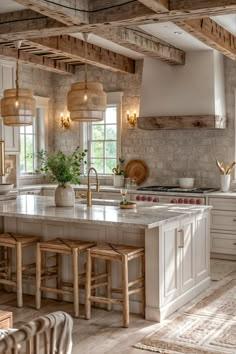 a kitchen with an island and stools in it