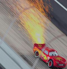 a red car with flames coming out of it