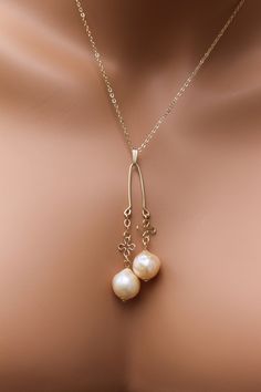 Beautiful Natural Japanese Lariat Pearl necklace  These beautiful Pearls have been wire wrapped in our studio in Texas Pearl Specs: Pearl Type: Japanese Pearls   Edison Pearl Color: Intense Gold Pearl reflective surface: Outstanding Pearl luster: AAA Pearl Shape: Baroque round  Metal: 14KY Gold filled Necklace size: 18 inches inner part, 21.5 inch drop Professional settings and high-resolution cameras have been used to photograph this incredible jewelry, colors may vary from monitor to monitor. Please let us know if you need a matching Necklace, we will be more than happy to create it for you. If this purchase is a gift and is going directly to the recipient, we can gift box it and send a special handwritten note for you to commemorate your special event. Blank cards are available for any Anniversary Gifts Ideas, Japanese Pearls, Cross Charm Necklace, Jewelry Cross, Bridal Accessory, Edison Pearls, Pearl Types, Necklace Size, Wedding Fashion