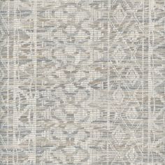 an area rug with grey and white designs on the side, in shades of gray