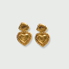 Our Sacred Heart Earrings have all the details, featuring a bold, line-engraved heart diffusing flames and divine rays of light. These beauties are lightweight and make a perfect addition to any jewelry collector. The Sacred Heart is popular throughout Mexico. It signifies the higher power of divine love for humanity. Details: 14k Gold-Filled Height: 3 cm / 30 mm Width 2 cm / 20 mm Hypoallergenic, Nickle Free, and Lead-Free Sacred Heart Earrings, Love For Humanity, Rays Of Light, The Sacred Heart, Divine Love, Heart Stud Earrings, Heart Studs, Heart Earrings Studs, Sacred Heart