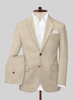 Make every occasion an opportunity to dazzle and delight with our Italian Cotton Silk Reyes Suit, which evokes the vision of being extraordinary. Tailored with the finest weaves of cotton and silk blend, it whispers a soft touch upon the skin, and the beige shade casts a warm glow upon the wearer. The subtle dotted pattern lends an air of mystique amongst style mavens. Whether gracing high-class soirees or fancy formal gatherings, this suit will grace your discerning taste and will leave an indelible impression on all.  
 
An elusive unique piece from our Red Carpet Collection. 
 
Look features a 2 button jacket with notch lapels, horn brown buttons, single vent, three cuff buttons and two welted back pockets on trousers.   Click 'Customize Now' to modify the look if needed.  
 
 Lining: Fitted Beige Tweed Jacket With Long Sleeves, Beige Long Sleeve Tweed Jacket For Semi-formal Occasions, Beige Long Sleeve Blazer For Semi-formal Occasions, Beige Long Sleeve Blazer For Semi-formal, Beige Long Sleeve Semi-formal Blazer, Tailored Beige Tweed Jacket, Tailored Beige Tweed Jacket With Long Sleeves, Tailored Long Sleeve Beige Tweed Jacket, Silk Long Sleeve Business Casual Outerwear