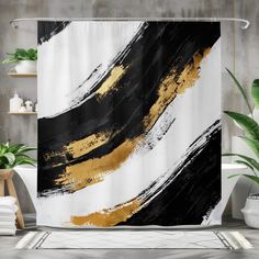 a shower curtain with black, white and gold paint strokes on the outside of it