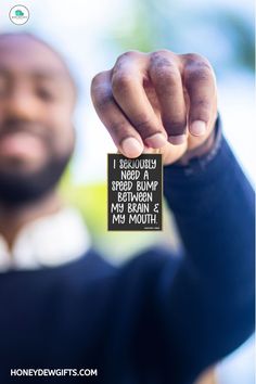 a man is holding up a sign that says i regularly spread hump between my mouth and my mouth