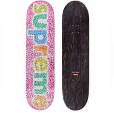 two skateboards decorated with beads and the words do something written on them are standing side by side